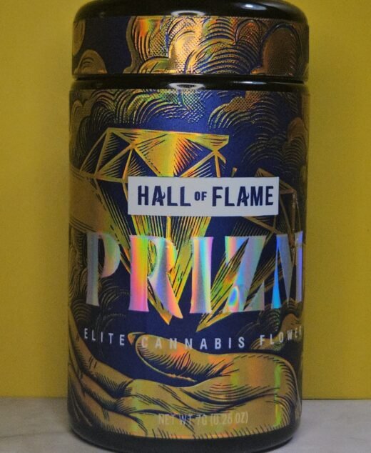 PRIZM by HALL OF FLAME elite cannabis flower 7g holographic jar on yellow background