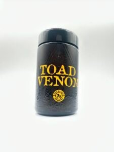 TOAD VENOM by HALL OF FLAME black jar with yellow lettering and all-seeing eye frog design