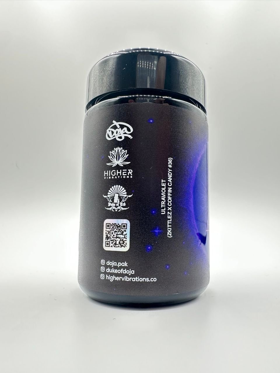 Side view of ULTRAVIOLET By DOJA jar showing Doja Higher Vibrations Duke of Erb logos and QR code