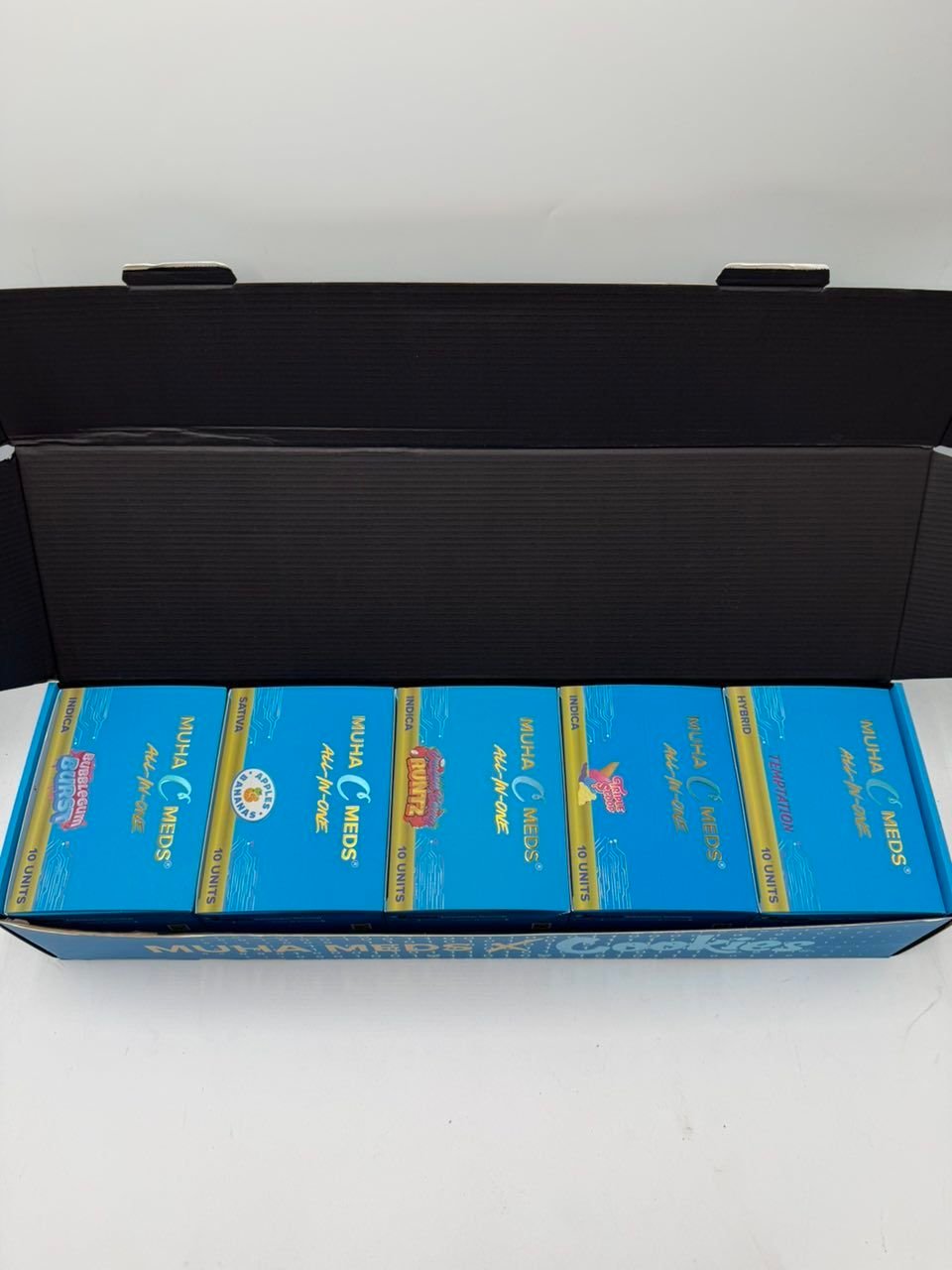 Cookies Muha Meds Vapes assortment of flavor boxes in black case