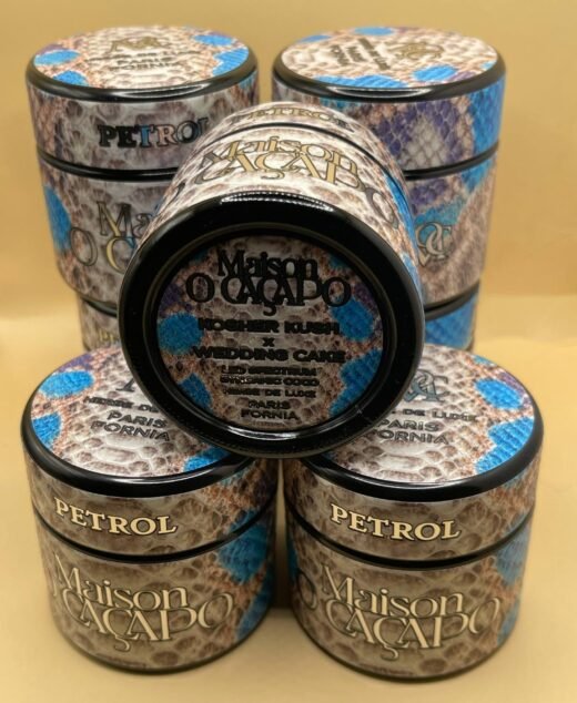 PETROL by MAISON O CACAPO luxury cannabis jars stacked with snakeskin design and blue accents showing premium packaging