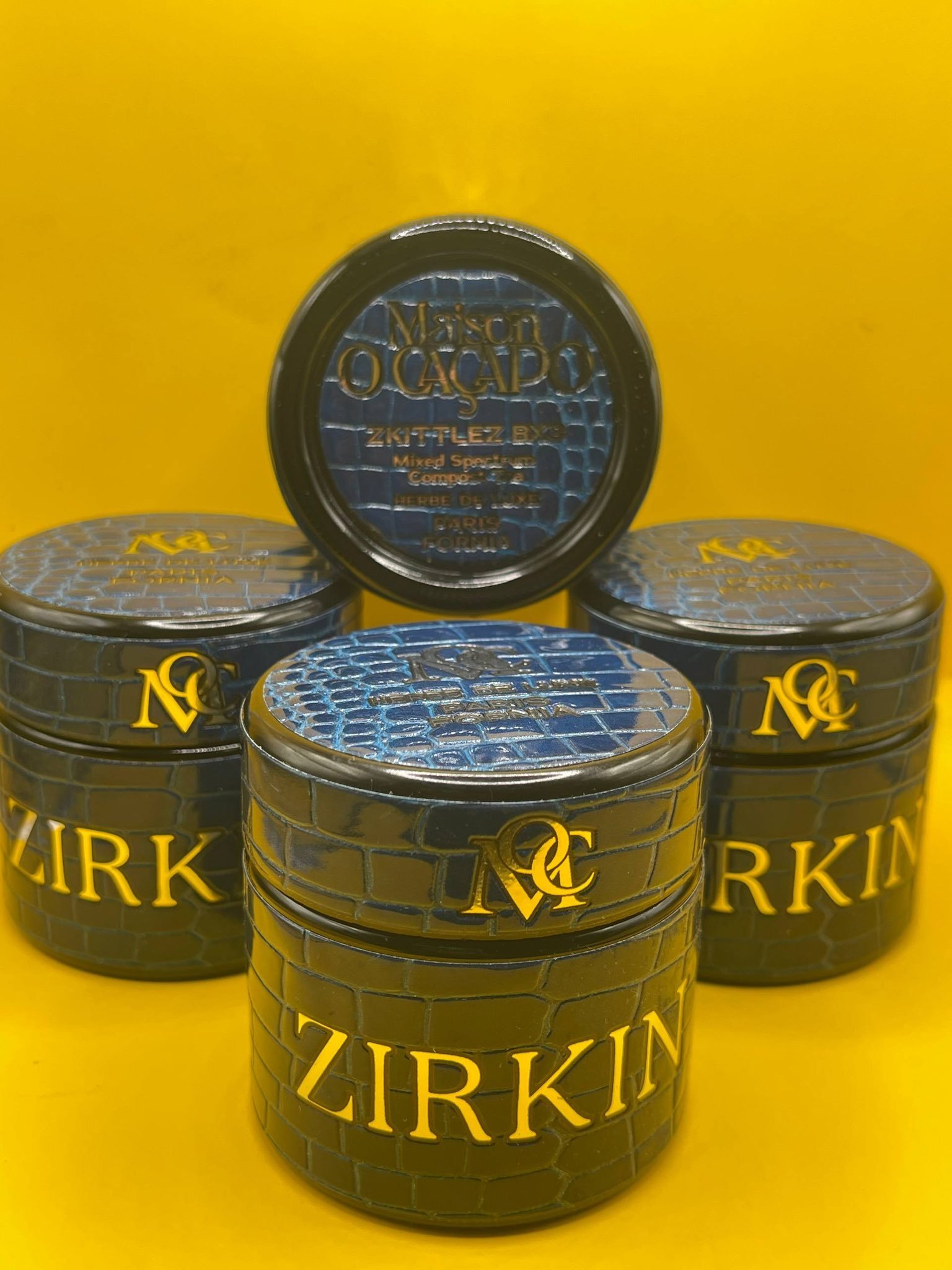 ZIRKIN by MAISON O CACAPO luxury designer jars stacked showing snakeskin blue packaging and Herbe De Luxe branding